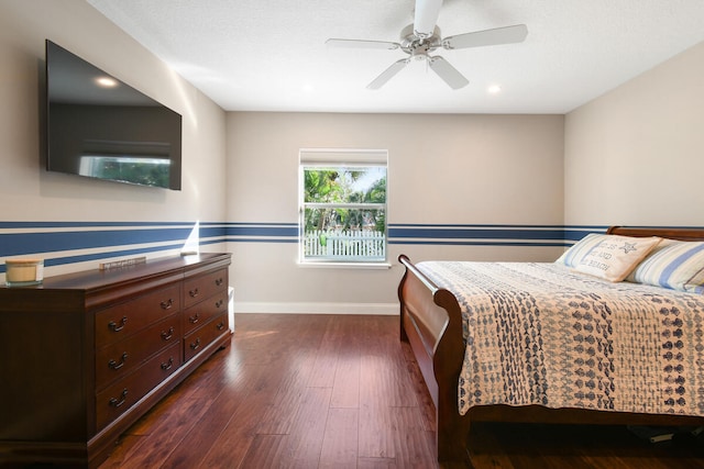 bedroom with dark wood-type flooring and ceiling fan