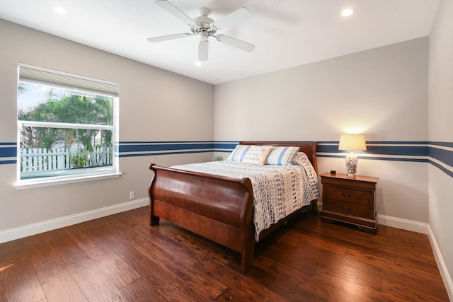 bedroom featuring ceiling fan and dark hardwood / wood-style floors