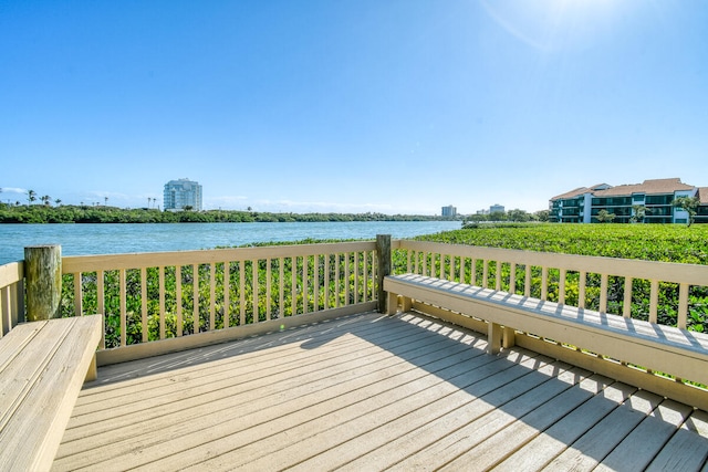 wooden deck featuring a water view