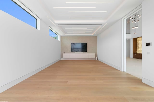 hallway with light hardwood / wood-style floors