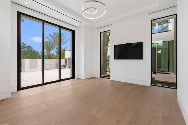 unfurnished living room with light wood-type flooring