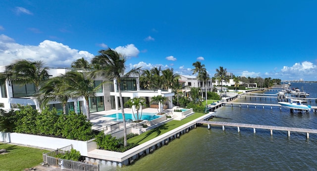 exterior space with a patio and a water view