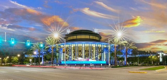 view of outdoor building at dusk