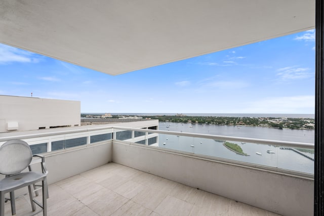 balcony featuring a water view