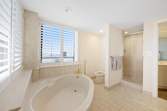 bathroom featuring vanity, a bidet, shower with separate bathtub, and tile flooring