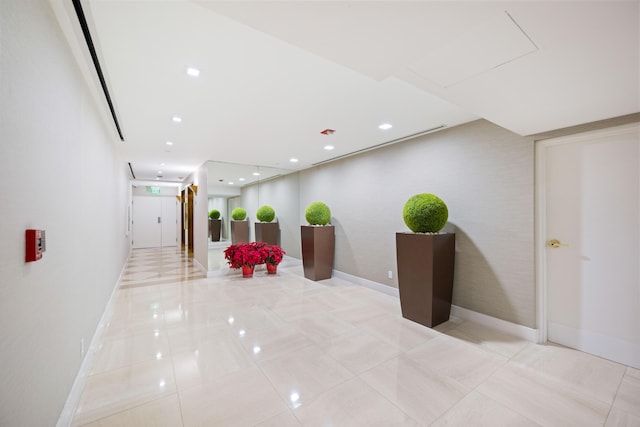 hall featuring light tile floors