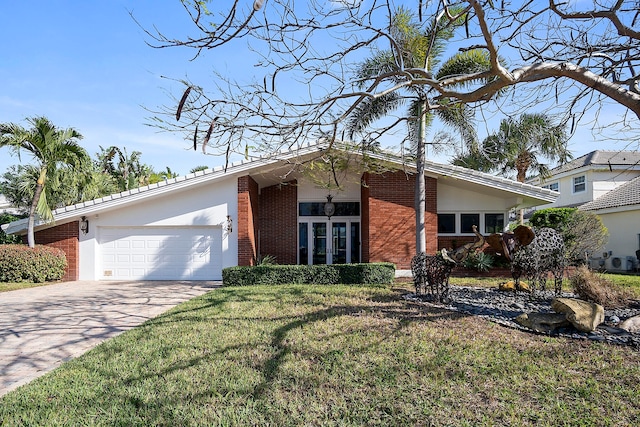 ranch-style home featuring a front yard and a garage