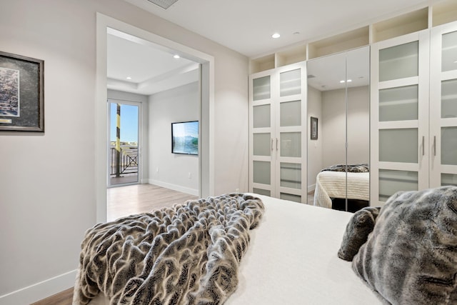 bedroom with light hardwood / wood-style flooring