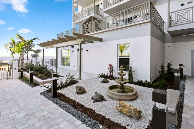 view of patio featuring a balcony