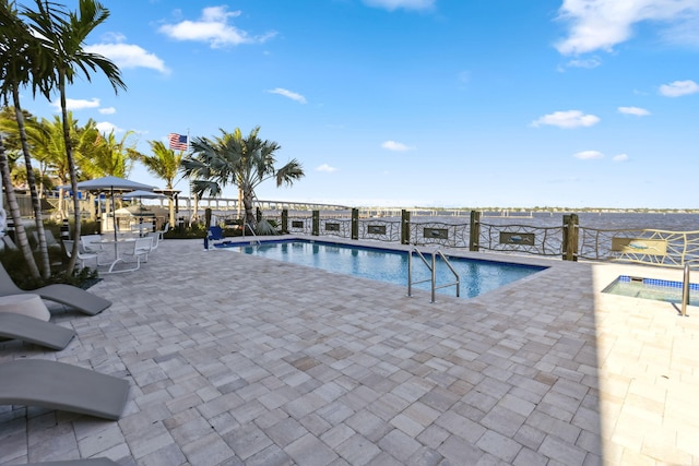 41 SW Seminole St Unit 404, Stuart, FL 34994 - community pool with a patio
