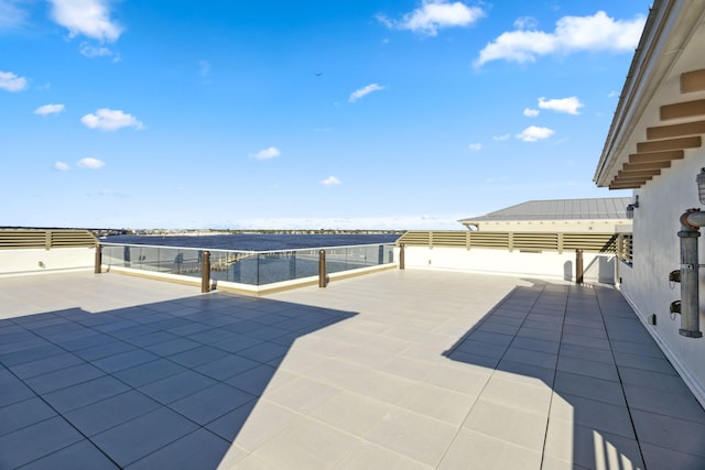 view of patio with a water view