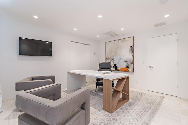 office space with recessed lighting, visible vents, and light wood finished floors