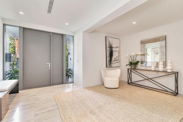 foyer entrance with recessed lighting and visible vents