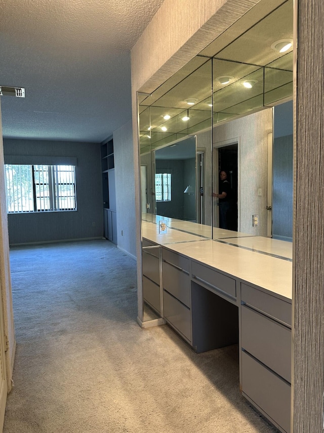 bathroom featuring vanity and a textured ceiling