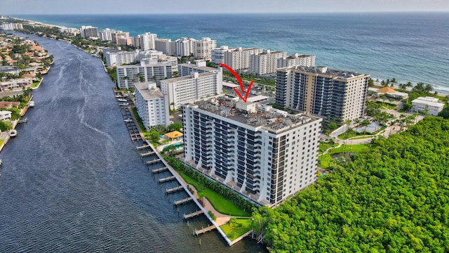 birds eye view of property with a water view