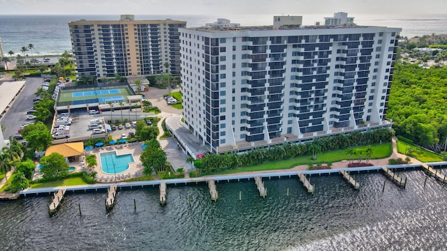 birds eye view of property with a water view