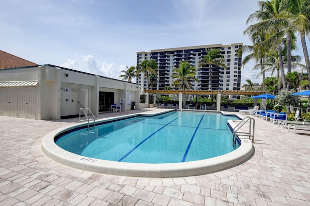 view of swimming pool featuring a patio