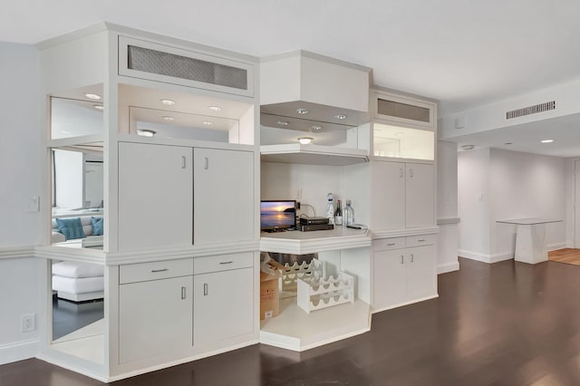 kitchen with white cabinets and dark hardwood / wood-style floors