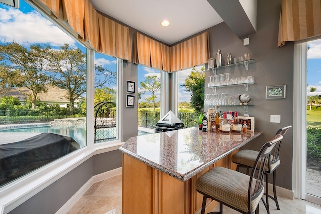 bar featuring light stone counters