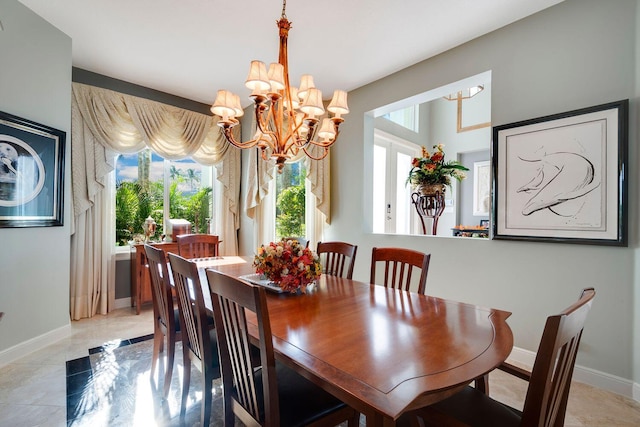 dining area featuring an inviting chandelier