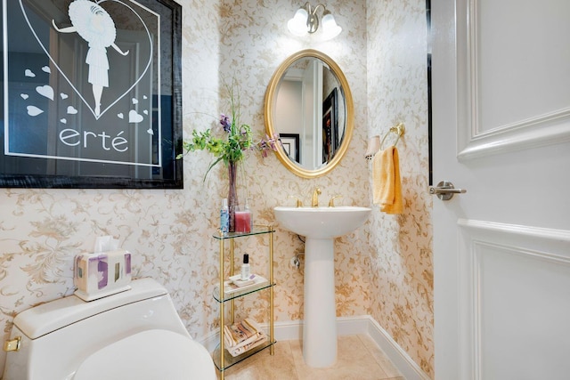 bathroom with tile patterned flooring and toilet