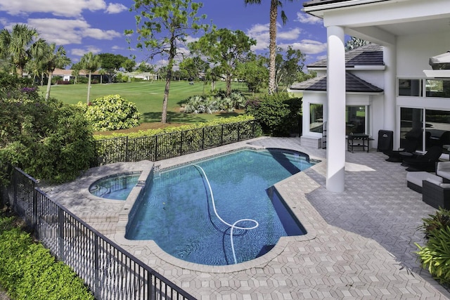 view of pool with a patio and an in ground hot tub