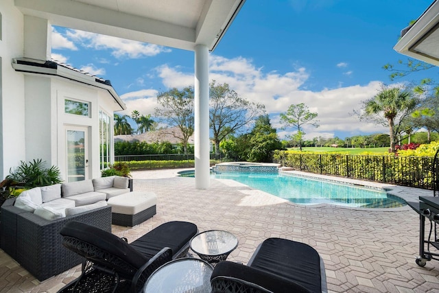 view of swimming pool featuring an outdoor living space, an in ground hot tub, and a patio area