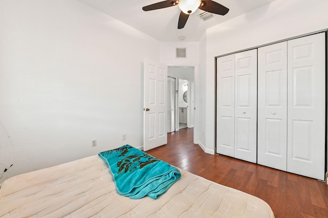 bedroom featuring a closet, ceiling fan, and dark hardwood / wood-style floors