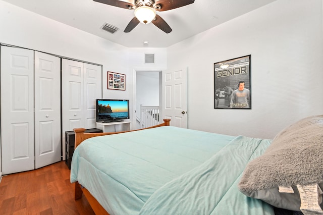 bedroom with wood-type flooring, a closet, and ceiling fan