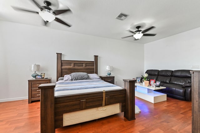 bedroom featuring dark wood-type flooring and ceiling fan