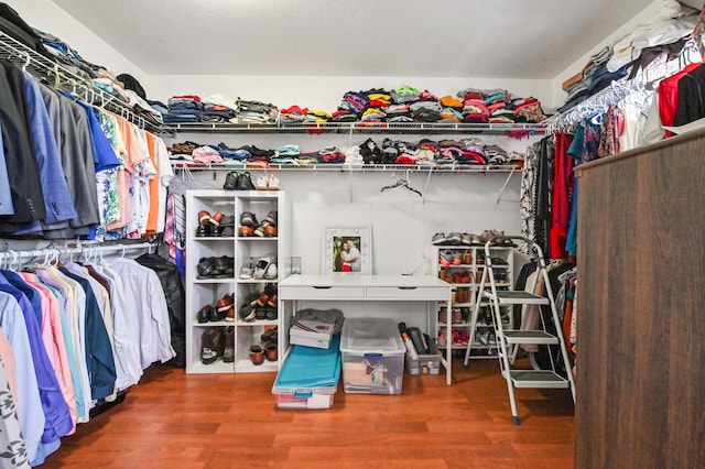 spacious closet featuring hardwood / wood-style flooring