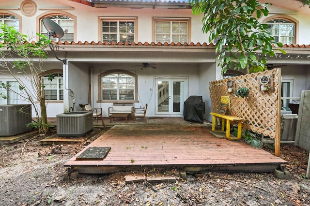 back of house featuring a wooden deck, central AC unit, and ceiling fan