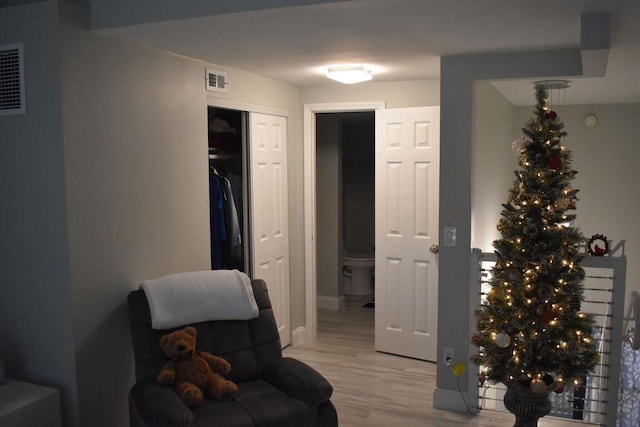 living area featuring light hardwood / wood-style floors