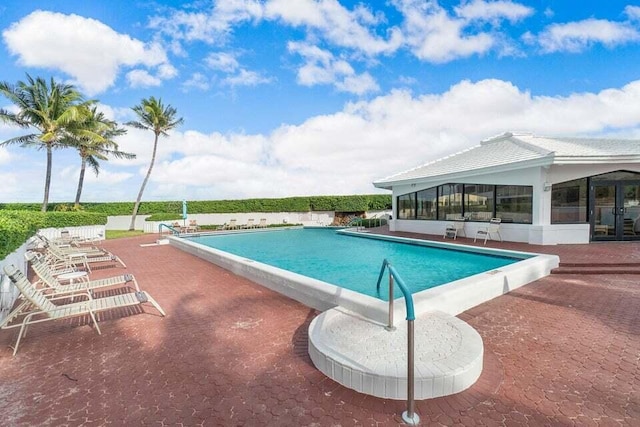 view of swimming pool with a patio