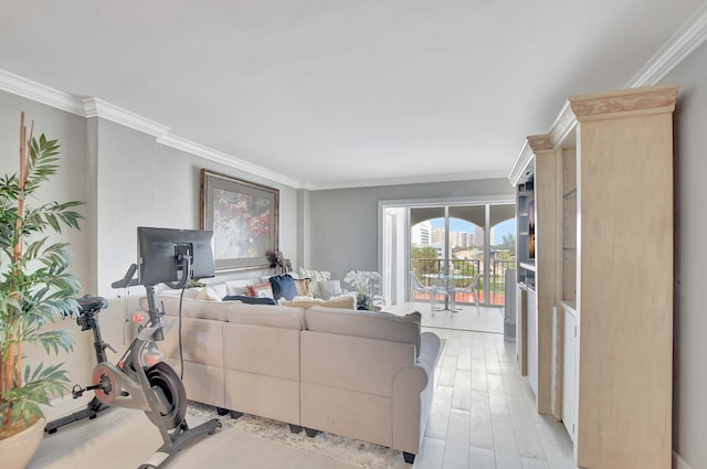 living room with crown molding and light wood-type flooring