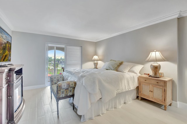 bedroom with ornamental molding and light hardwood / wood-style flooring