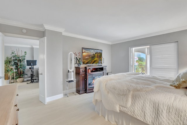 bedroom featuring crown molding and light wood-type flooring