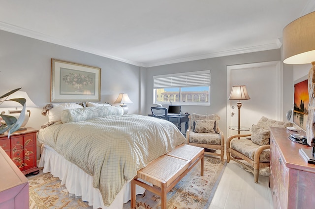 bedroom featuring light hardwood / wood-style floors and ornamental molding