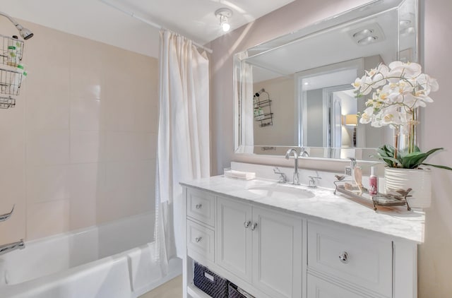 bathroom with vanity and shower / bath combo