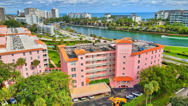 birds eye view of property with a water view