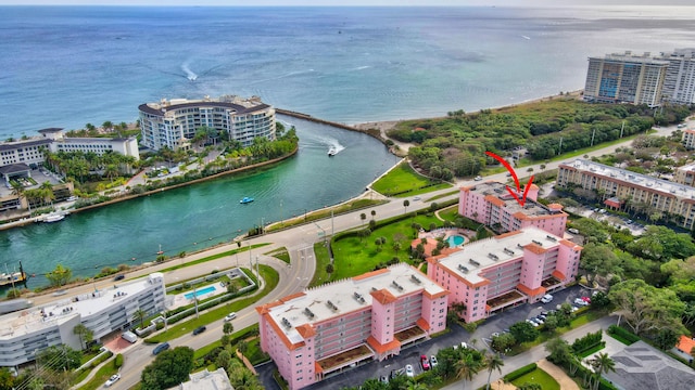 birds eye view of property with a water view