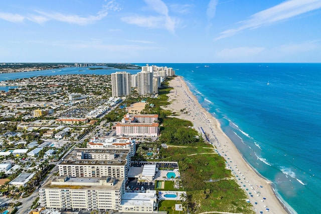 aerial view featuring a view of the beach and a water view