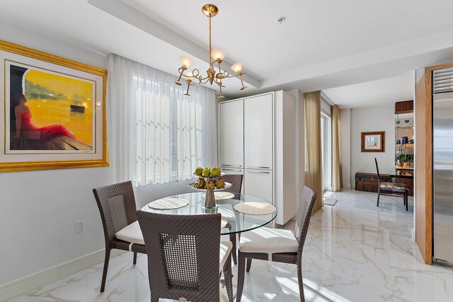 dining area featuring a chandelier