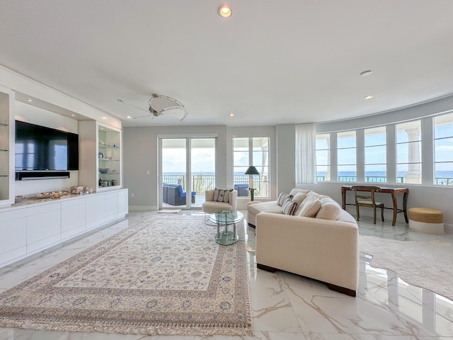 living room with built in features and a wealth of natural light