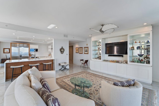 living room with ceiling fan