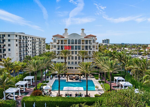 view of swimming pool with a patio and a water view