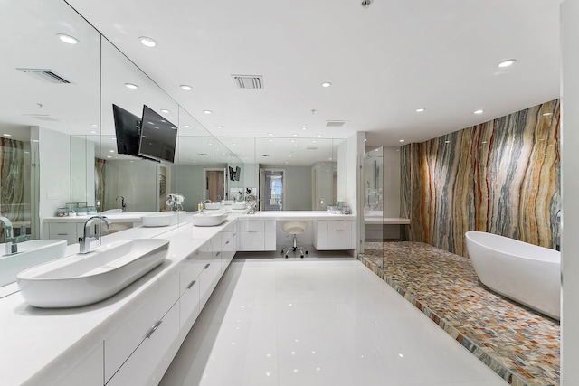 bathroom featuring tile patterned flooring, vanity, and independent shower and bath