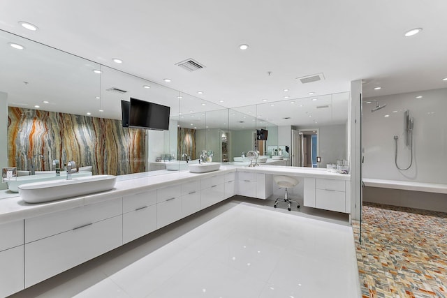 bathroom with tile patterned flooring and vanity