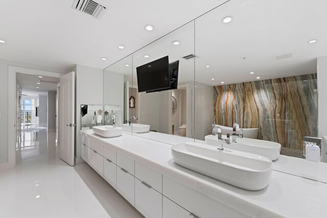 bathroom featuring vanity and walk in shower