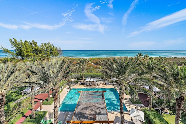 view of pool with a water view